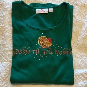 QF green short sleeve top with embroidered “Gobble til you Wobble” (XL)